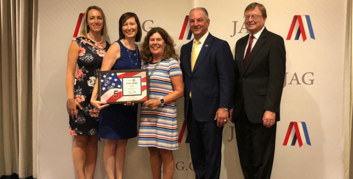 JAG National and IN JAG staff holding the JAG 5 of 5 award