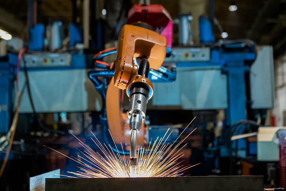 Robotic Welding Arm Creating Sparks While Working