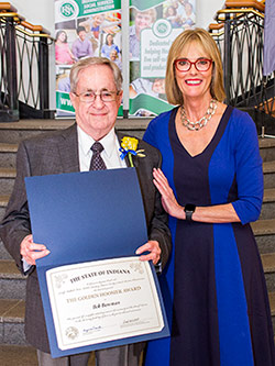 Picture of Bob Bowman receiving the award from the Lieutenant Governor
