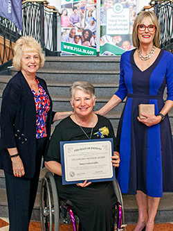 Picture of Nancy Griffin receiving the award from the Lieutenant Governor