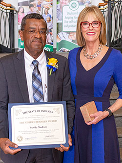 Picture of Stanley Madison receiving the award from the Lieutenant Governor