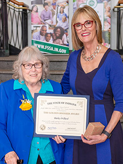 Picture of Shirley Willard receiving the award from the Lieutenant Governor