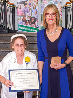 Picture of Bertie McKenna receiving the award from the Lieutenant Governor