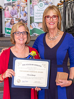 Picture of Cherie Rump receiving the award from the Lieutenant Governor