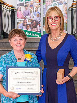 Picture of Bernice Stacey receiving the award from the Lieutenant Governor