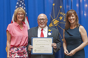 Photo of Ray Black receiving the award