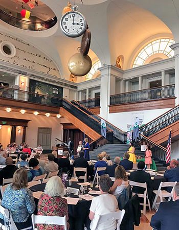 Picture of tables with winners and guests