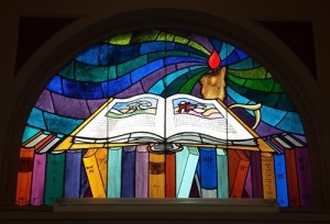 The stained glass window over the front entrance.