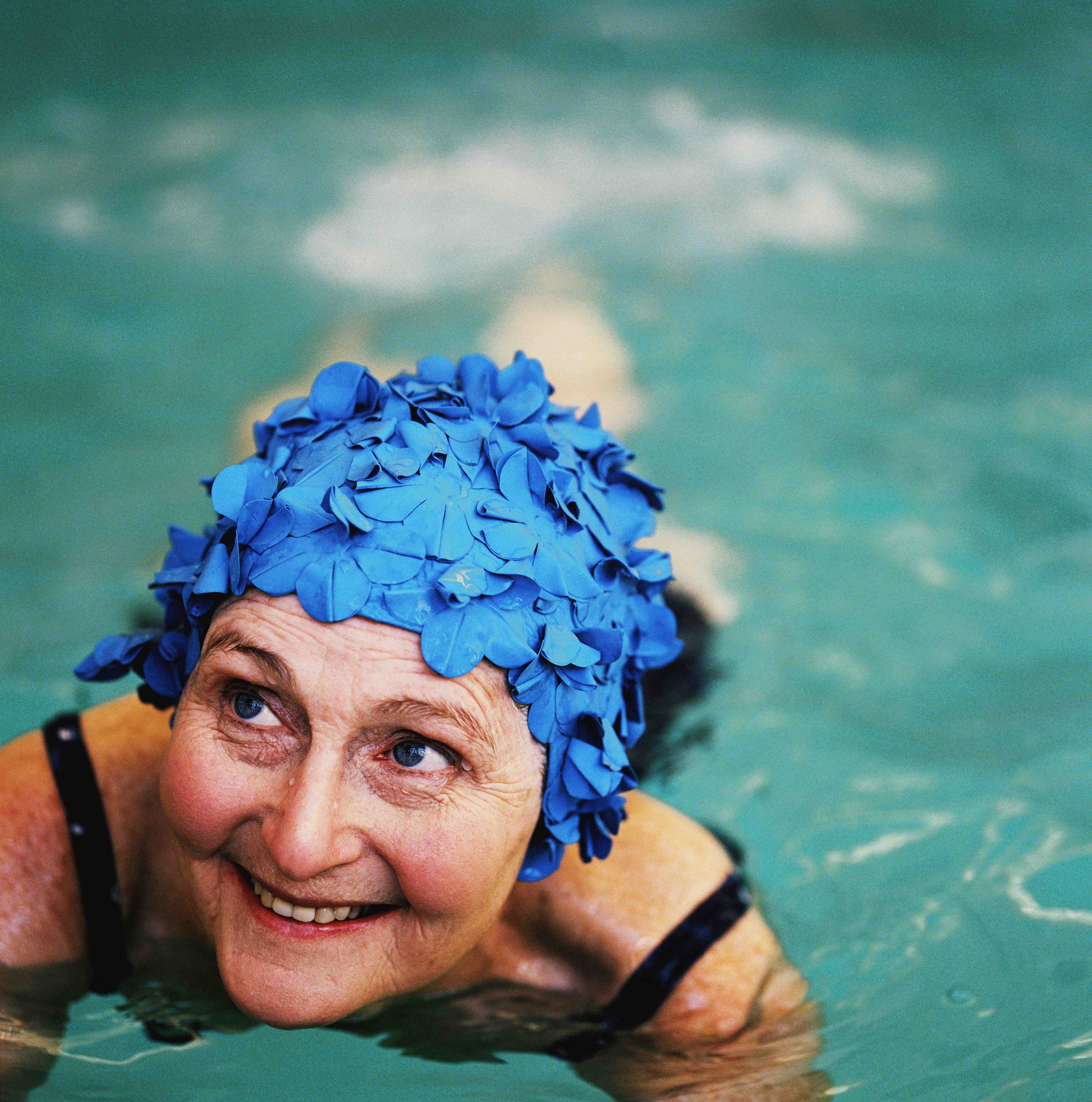 woman in swimming cap in pool