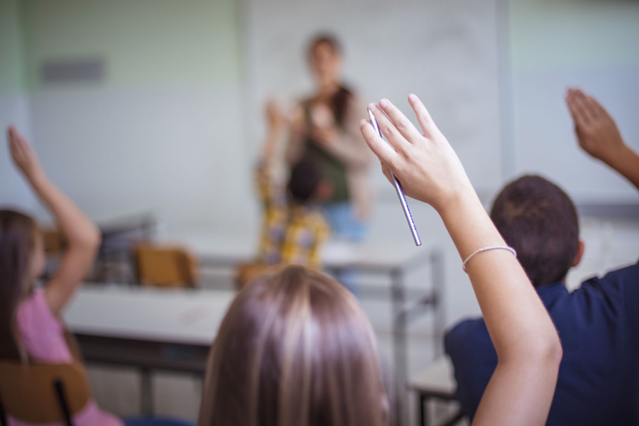 students raising hand