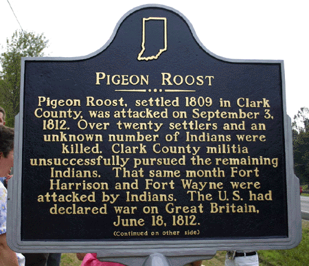 Side one of the marker. The marker is located at the entrance to Pigeon Roost State Historic Site, US 31, 5 miles south of Scottsburg.