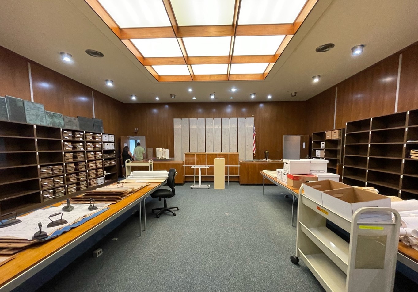 The City-County Archive exists inside of the old circuit court rooms, so this room, which now serves as a vault, was originally a court room, with the Judge&rsquo;s desk still exactly in the same place as it was when this room functioned as a court room. 