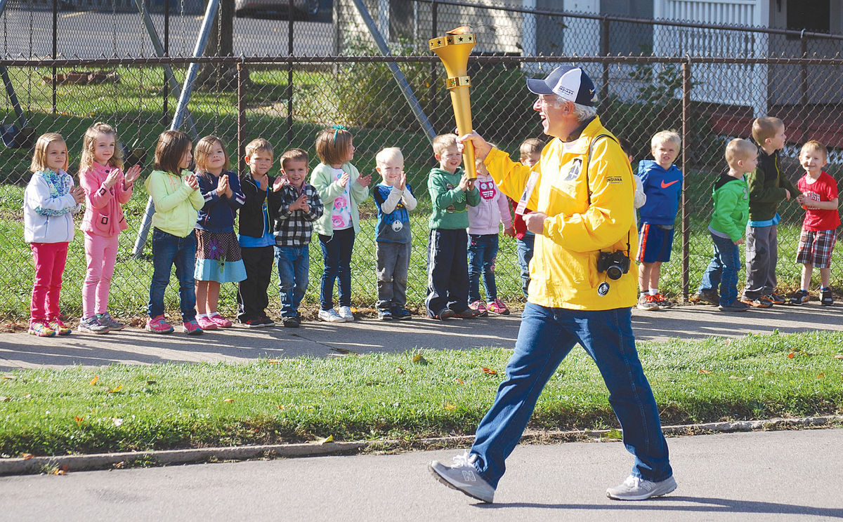 Torchbearer with kids