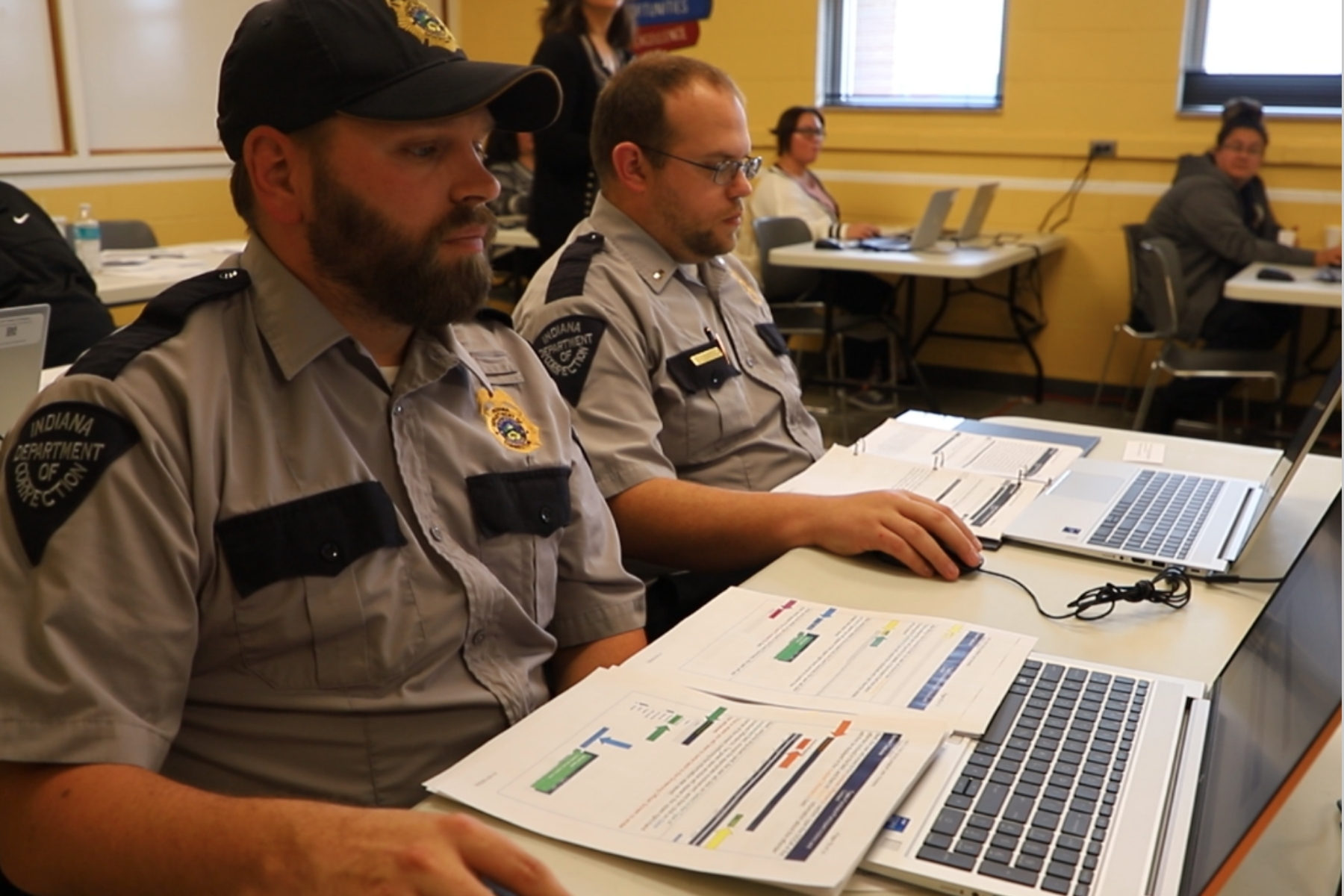 Correctional officer participating in classroom training to learning the new Delta Software.