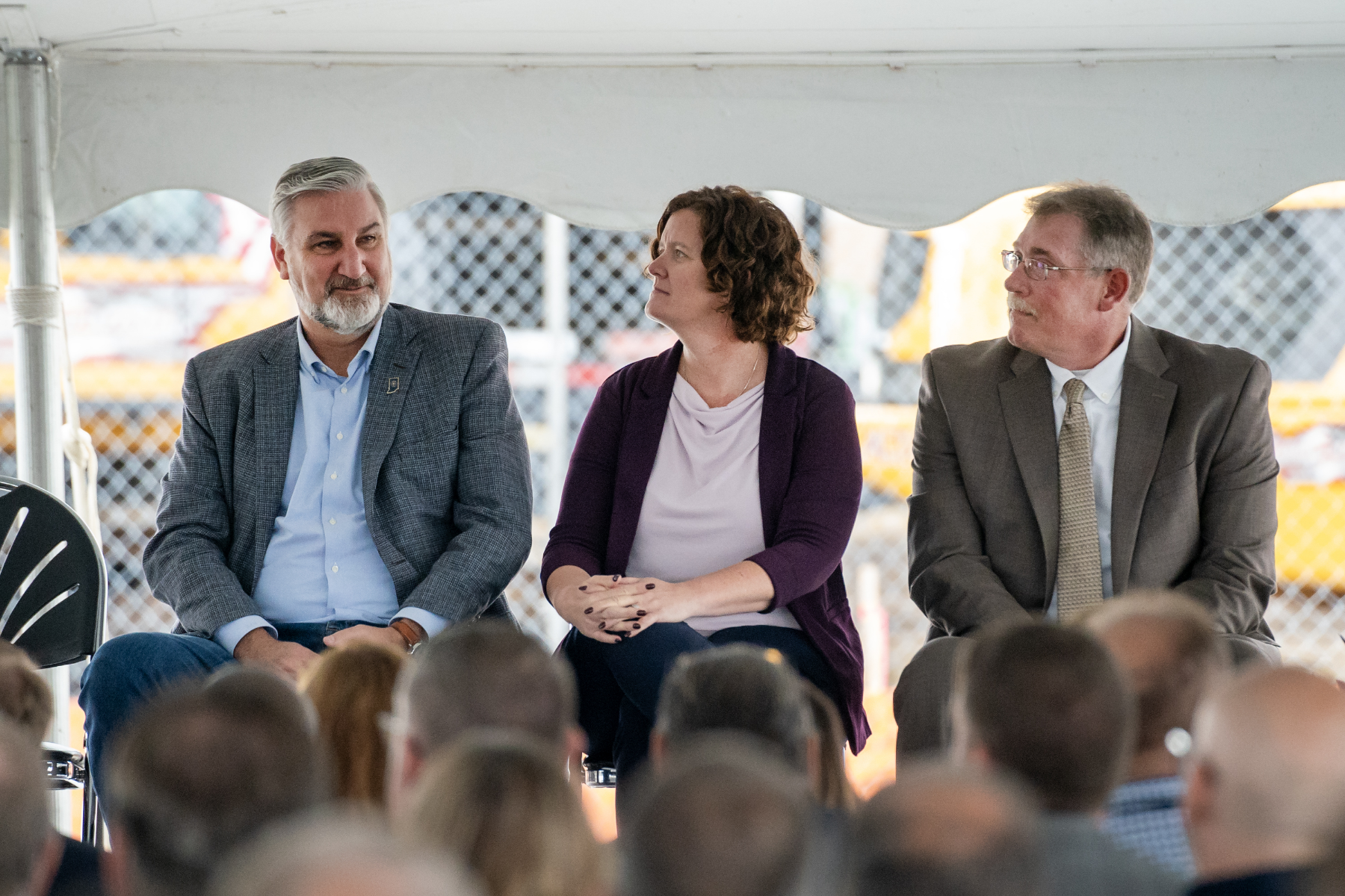 Governor Eric Holcomb, IDOC Commissioner Christina Reagle and Executive Director of Construction Services Kevin Orme listen to a speaker on Thursday, Sep. 28, 2023 during a groundbreaking for the new $1.2 Billion correctional facility under construction in Westville, Indiana. SCOTT ROBERSON | Indiana Department of Correction