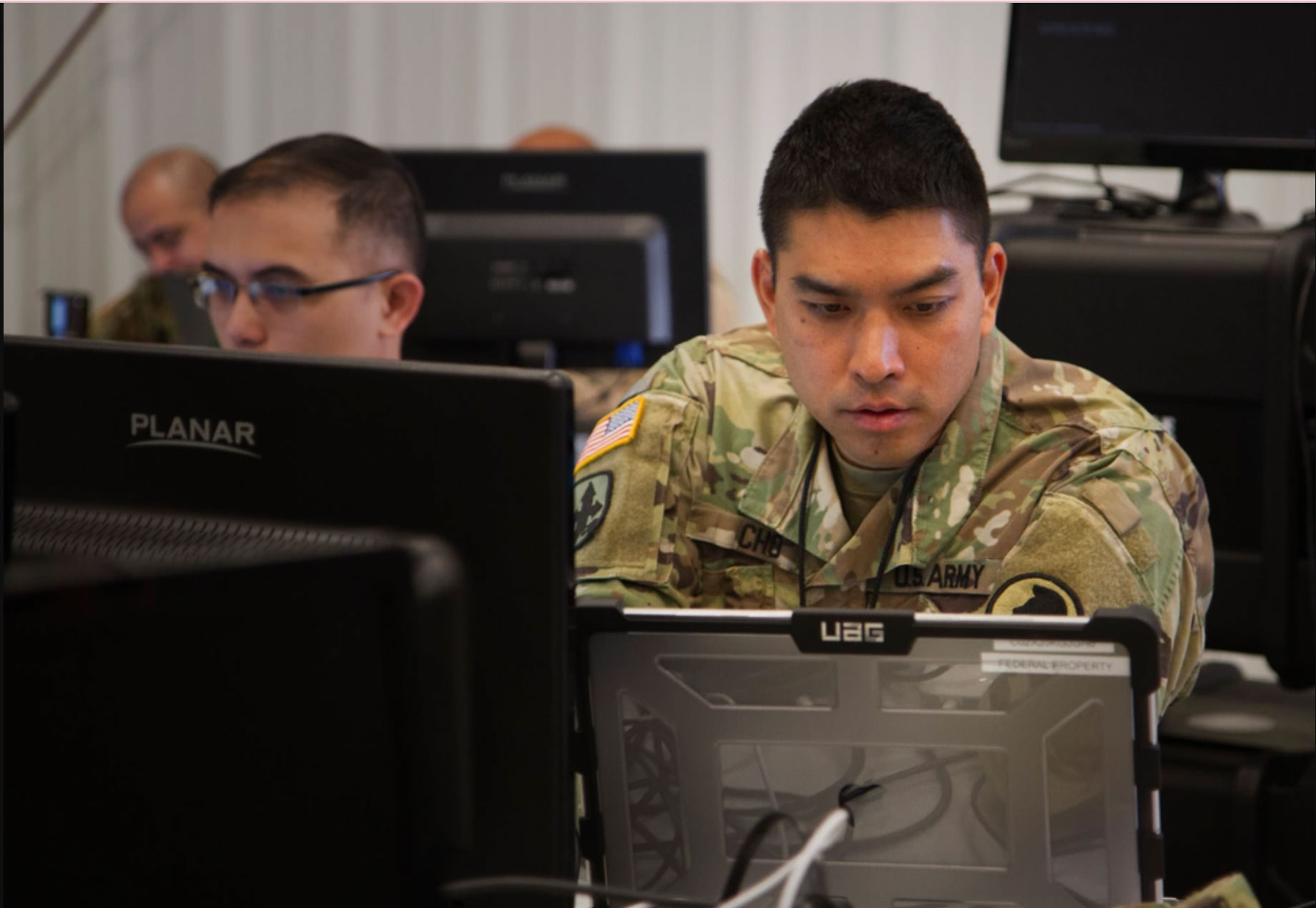 Soldier working on computer at Stout Field