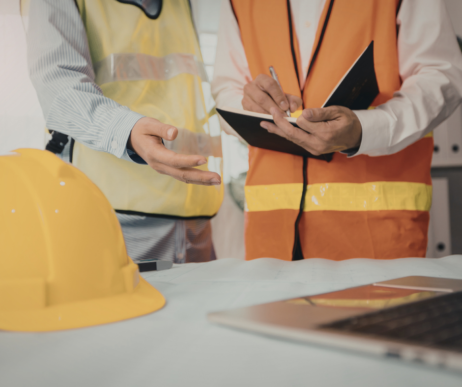 people in protective vests looking through documents