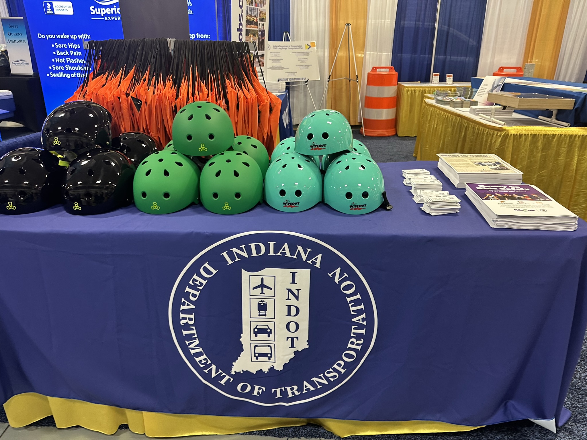 Bike helmets on a table in INDOT's indoor booth