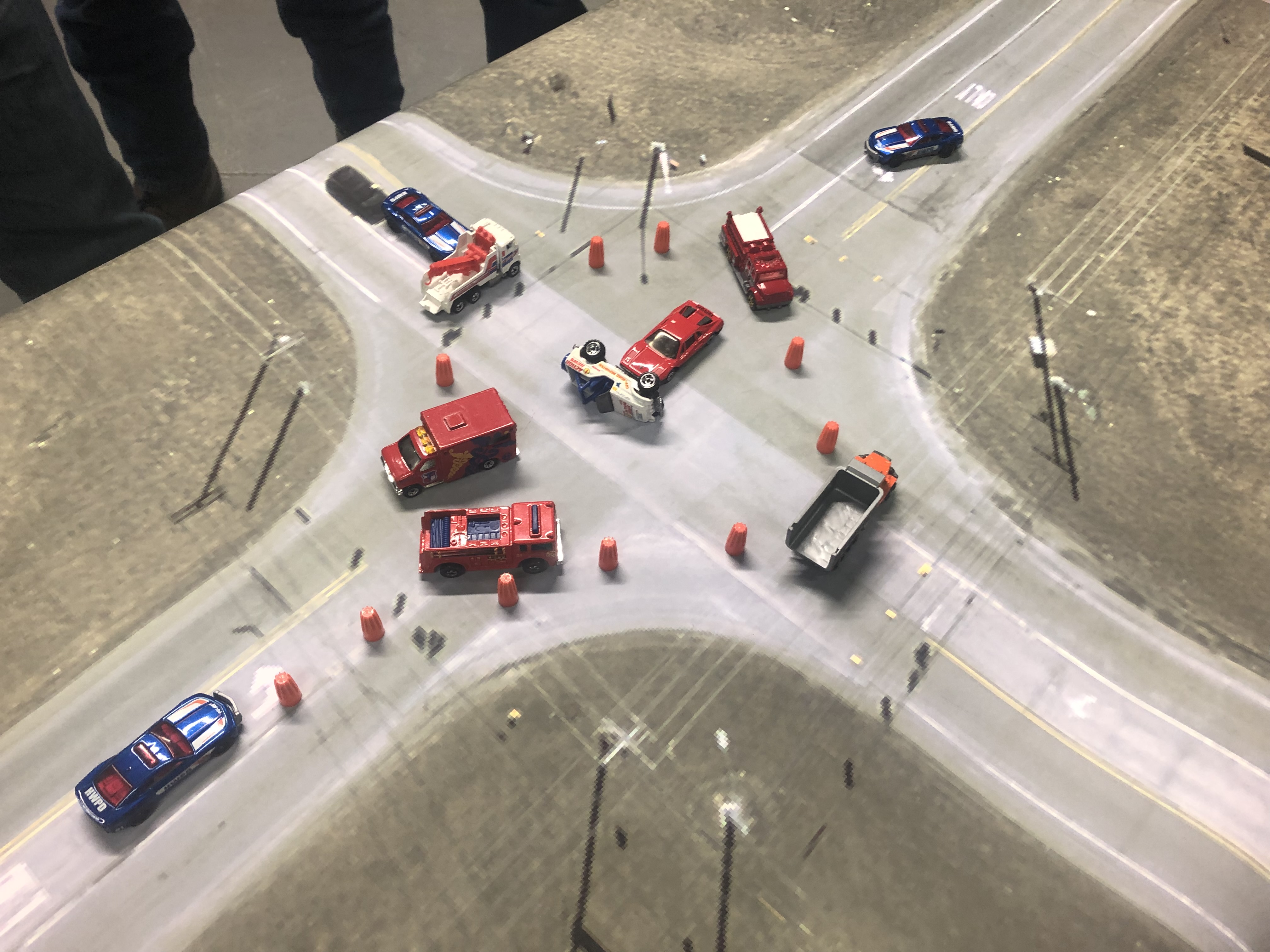 Traffic Incident Management shows an example using toy cars of a 4-way intersection crash