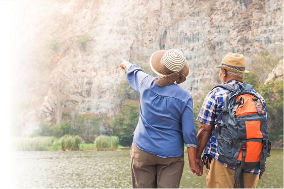A retired couple looking off in the distance