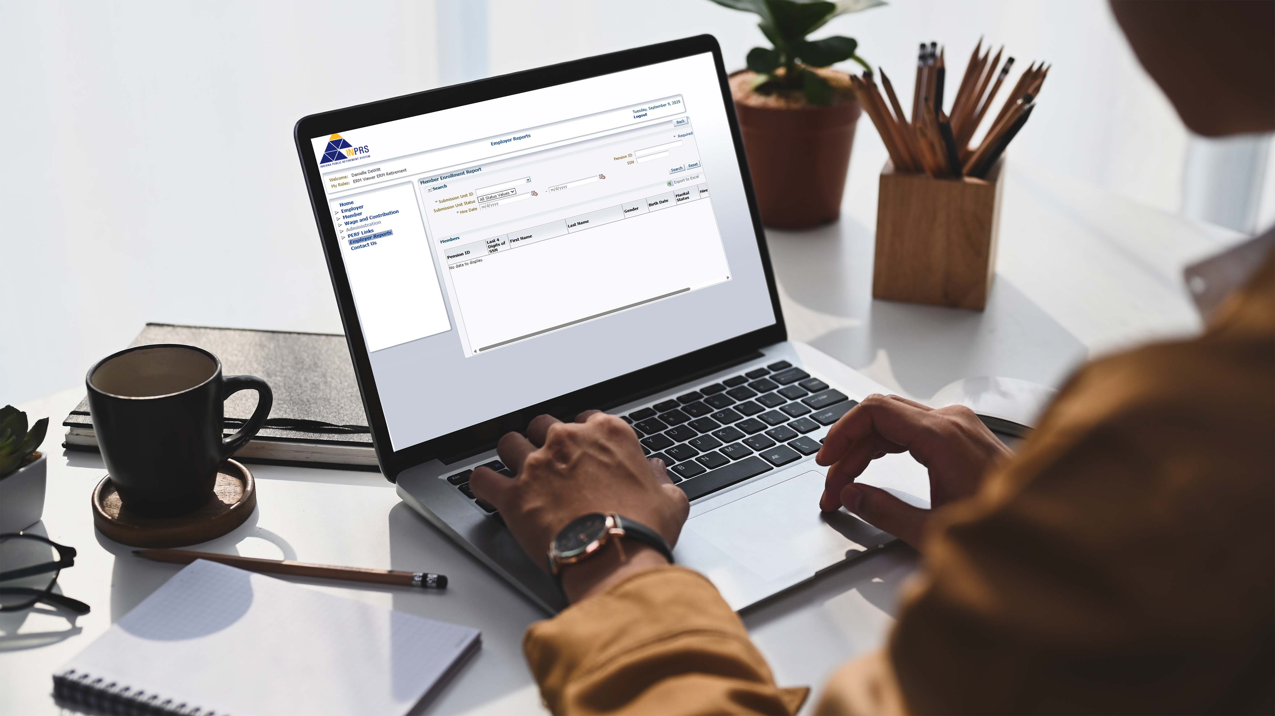 Picture of a laptop with the INPRS Employer Reporting software on the screen.