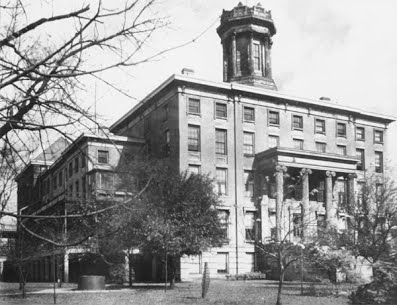  Black and white photo of old school downtown