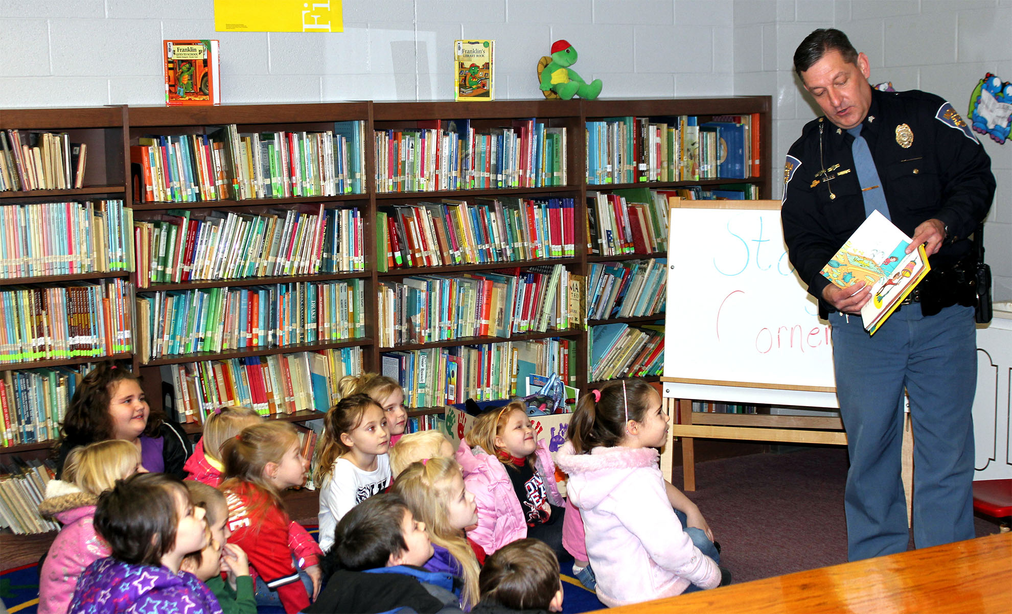 ISP Sgt. Jerry Goodin reads to a kindergarten class
