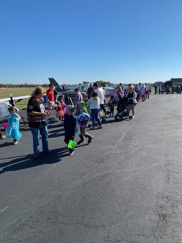 Trick-or-Treaters visiting airplanes
