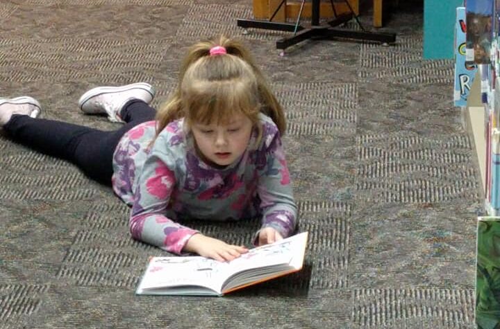 Child reading a book