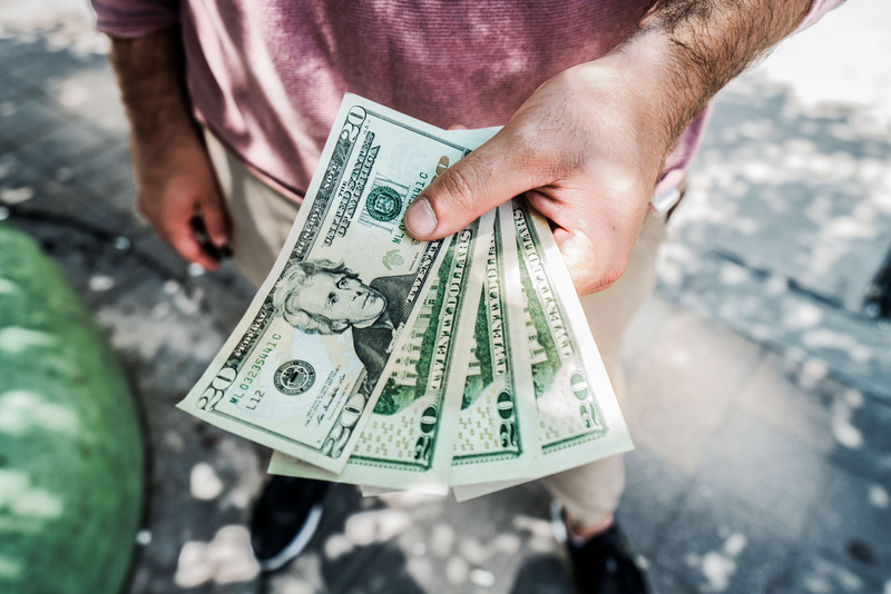 Man holding dollar bills
