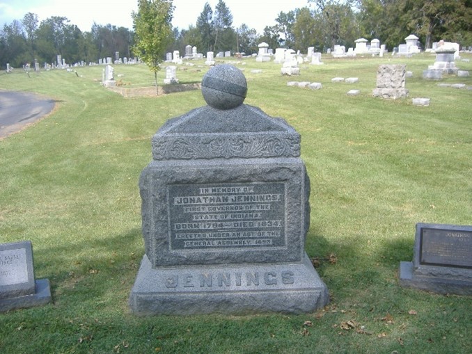 A tombstone in a cemeteryDescription automatically generated