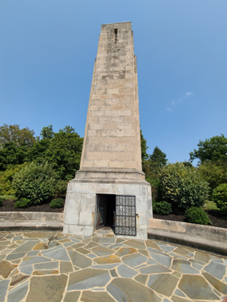 A tall tower with a hole in the middleDescription automatically generated